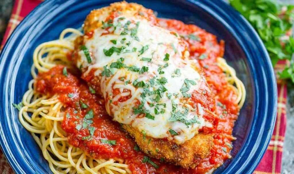 chicken-parmesan-recipe-served-over-pasta