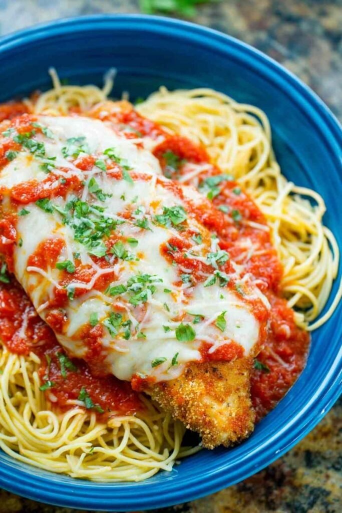 chicken-parmesan-recipe-served-over-pasta